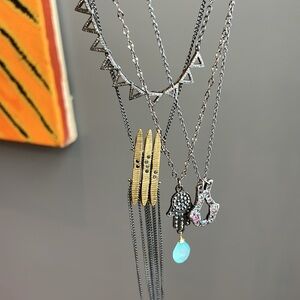 2 remaining from the silver. The diamond triangle choker and the Geoffrey Young.